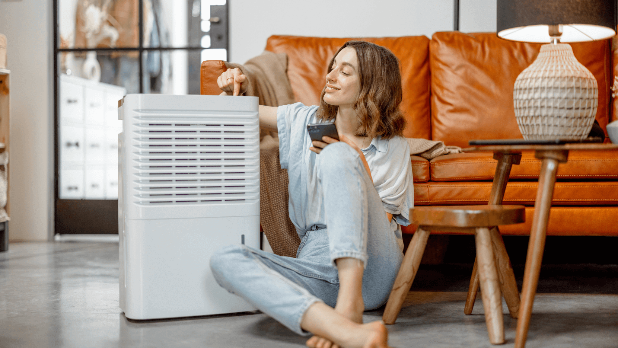 Wman sitting next to air purifier