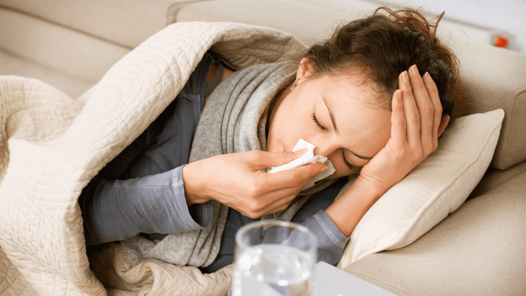 woman sick on couch